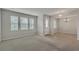 Living room with carpet, neutral walls and entryway at 8217 De Haven Street, Orlando, FL 32832