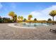 Resort-style community pool with palm trees and lounge chairs at 2428 Dubai St, Kissimmee, FL 34747