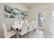 Bright dining room with white table and six chairs at 2428 Dubai St, Kissimmee, FL 34747