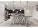 Modern kitchen with stainless steel appliances and an island with seating at 2428 Dubai St, Kissimmee, FL 34747