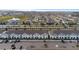 Aerial view of townhouses with parking and a main road at 2428 Dubai St, Kissimmee, FL 34747