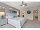 King-size bed, ensuite bathroom access, and stylish decor highlight this main bedroom at 2428 Dubai St, Kissimmee, FL 34747