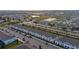 Aerial view of a community with townhouses and a lake at 2428 Dubai St, Kissimmee, FL 34747
