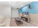 Bright game room with TV, comfortable seating, and access to two bedrooms at 2428 Dubai St, Kissimmee, FL 34747