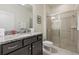 Bathroom with granite vanity, shower, and updated fixtures at 2428 Dubai St, Kissimmee, FL 34747