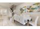 Modern dining area with white table and chairs at 2428 Dubai St, Kissimmee, FL 34747