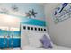 Charming bedroom with twin beds and themed decor at 2428 Dubai St, Kissimmee, FL 34747