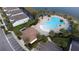 Community pool and clubhouse viewed from above at 2428 Dubai St, Kissimmee, FL 34747