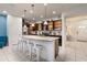 Modern kitchen with stainless steel appliances and an island with seating at 2428 Dubai St, Kissimmee, FL 34747