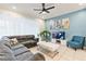 Spacious living room featuring a comfortable sectional sofa and large TV at 2428 Dubai St, Kissimmee, FL 34747