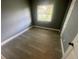 Spacious bedroom with grey walls and wood-look flooring at 830 Wooden Blvd, Orlando, FL 32805