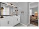 Double vanity bathroom with a view into a bedroom at 1087 Conestoga Way, Sanford, FL 32771