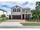 Two-story house with a two-car garage at 5200 Landmark Dr, St Cloud, FL 34771