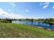 Scenic community lake with fountain and lush landscaping at 5200 Landmark Dr, St Cloud, FL 34771