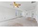 Large bedroom featuring a ceiling fan and multiple windows at 2548 Lyndscape St, Orlando, FL 32833