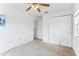 Bedroom with ceiling fan and double doors at 2548 Lyndscape St, Orlando, FL 32833