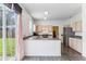 Kitchen features wood cabinets, stainless steel appliances, and a view to the backyard at 2548 Lyndscape St, Orlando, FL 32833