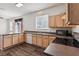 Efficient kitchen featuring ample counter space and wood cabinets at 2548 Lyndscape St, Orlando, FL 32833