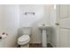 Clean bathroom with toilet, sink, and pedestal at 2548 Lyndscape St, Orlando, FL 32833