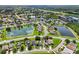 Aerial view of a beautiful community with houses, lakes, and lush green spaces at 2548 Lyndscape St, Orlando, FL 32833