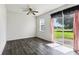 Simple bedroom with laminate flooring and sliding glass door at 2548 Lyndscape St, Orlando, FL 32833
