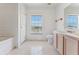 Bathroom with bathtub, toilet and double vanity at 2548 Lyndscape St, Orlando, FL 32833