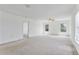 Main bedroom with two windows, ceiling fan and access to other rooms at 2548 Lyndscape St, Orlando, FL 32833
