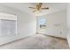 Empty bedroom with carpeted floor and ceiling fan at 2548 Lyndscape St, Orlando, FL 32833