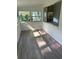Bright sunroom with wood-look flooring and multiple windows at 830 Wooden Blvd, Orlando, FL 32805