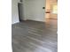 Spacious living room featuring wood-look floors at 830 Wooden Blvd, Orlando, FL 32805