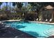 Inviting community pool with plenty of lounge chairs at 6320 Raleigh St # 604, Orlando, FL 32835