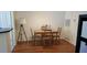 Small dining area with a wooden table and four chairs at 6320 Raleigh St # 604, Orlando, FL 32835