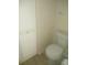Simple toilet and white cabinet in this small bathroom at 6320 Raleigh St # 604, Orlando, FL 32835
