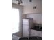 Efficient kitchen with white cabinets, microwave, and refrigerator at 6320 Raleigh St # 604, Orlando, FL 32835