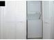 Stackable washer and dryer in a well-lit closet with white louvered doors at 703 Lucaya Loop # 1103, Davenport, FL 33897