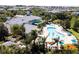 Aerial view of community pool with clubhouse and surrounding homes at 703 Lucaya Loop # 1103, Davenport, FL 33897