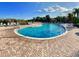 Resort-style swimming pool with lounge chairs at 703 Lucaya Loop # 1103, Davenport, FL 33897