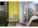 Private balcony with table and chairs, offering a view of the living area at 703 Lucaya Loop # 1103, Davenport, FL 33897