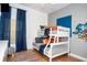 Bright bedroom with a bunk bed, colorful rug, and Mickey Mouse wall decal at 703 Lucaya Loop # 1103, Davenport, FL 33897