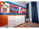 Mickey Mouse themed bedroom with dresser and rug at 703 Lucaya Loop # 1103, Davenport, FL 33897