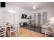 Open living and dining space with light wood floors and modern furnishings at 703 Lucaya Loop # 1103, Davenport, FL 33897