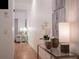 Light and airy hallway offering a view into the living area at 703 Lucaya Loop # 1103, Davenport, FL 33897