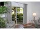 Living room with comfy seating, sliding doors, and wood floors at 703 Lucaya Loop # 1103, Davenport, FL 33897
