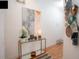 Bright entryway with glass console table, artwork, and decorative accents at 703 Lucaya Loop # 1103, Davenport, FL 33897