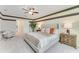 Main bedroom with king-size bed and access to a private bathroom at 3887 Malawi Trl, Saint Cloud, FL 34772