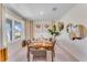 Bright dining room featuring a wooden table and large window at 3887 Malawi Trl, Saint Cloud, FL 34772