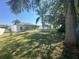 Large backyard with grassy area and partial fence at 573 Hummingbird Ct, Kissimmee, FL 34759