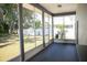 Relaxing screened porch overlooking a fenced backyard at 573 Hummingbird Ct, Kissimmee, FL 34759