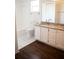 Updated bathroom with granite countertops and white cabinets at 573 Hummingbird Ct, Kissimmee, FL 34759