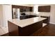 Spacious kitchen island with granite countertop and dark cabinetry at 573 Hummingbird Ct, Kissimmee, FL 34759